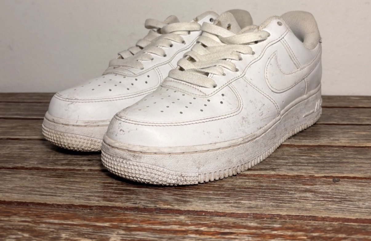 White Nike Air Force 1 sneakers before cleaning